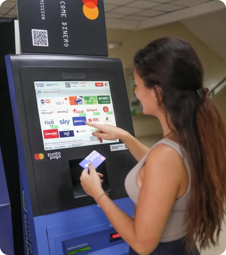 Customer using a Punto Pago kiosk